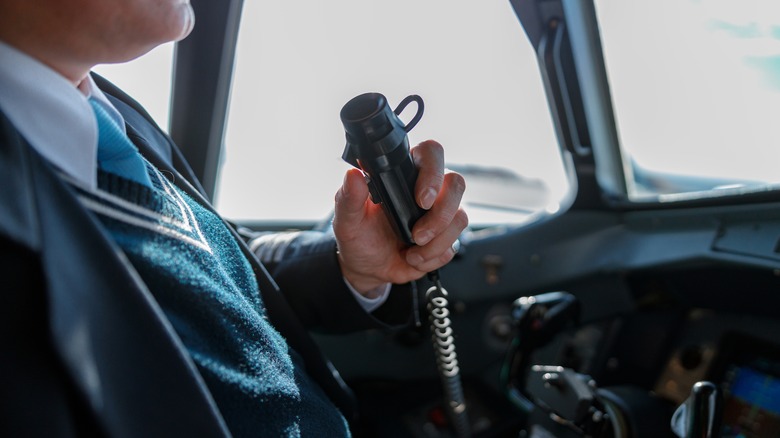 Pilot speaking into radio