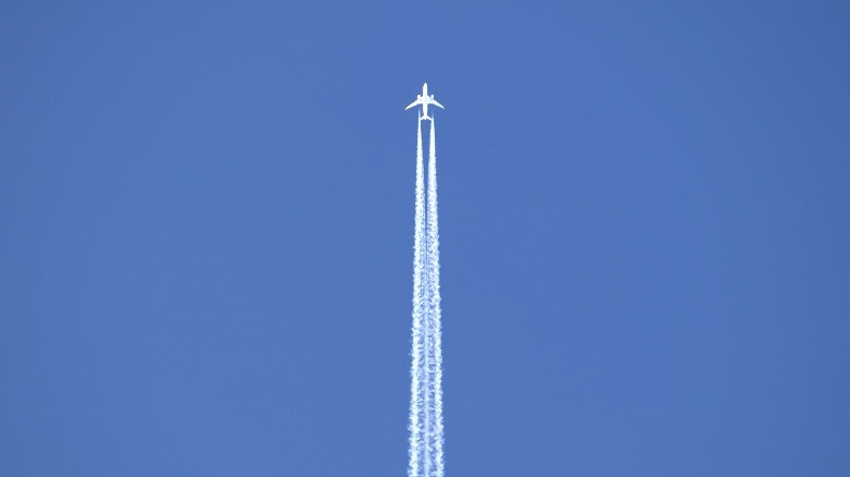 A passenger jet leaving contrails in the sky