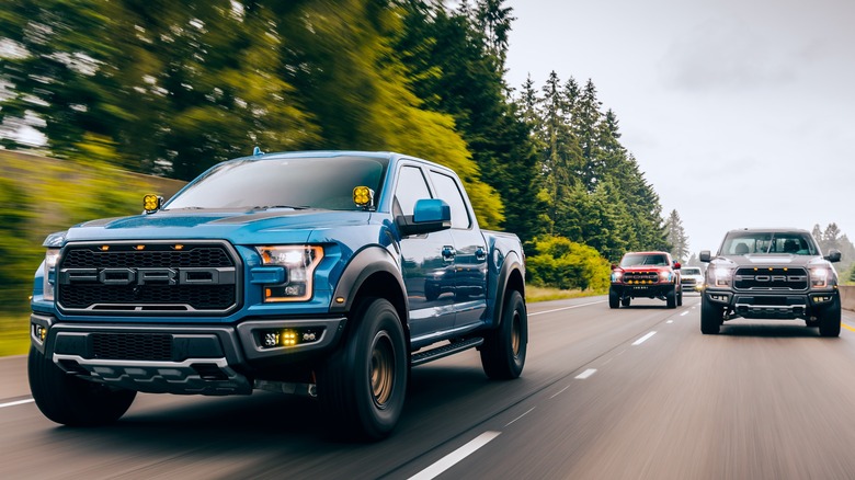 Ford trucks driving on highway