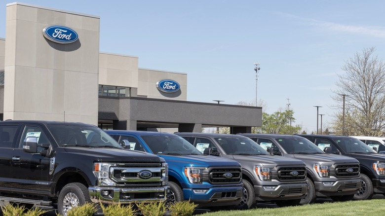 Ford cars parked outside a Ford building