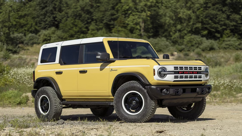 Yellow Ford Bronco Heritage Limited Edition parked sand