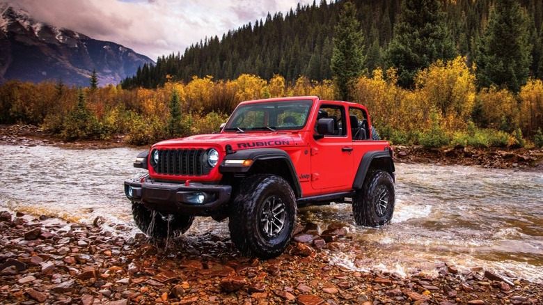 Exterior front image of the 2024 Jeep Wrangler crossing a river