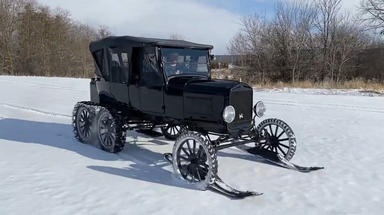 1926 Ford Model T five-passenger Touring Snowmobile driving through the snow.