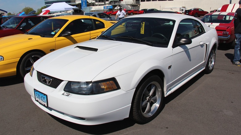 White 2000 Ford Mustang GT parked at a car show