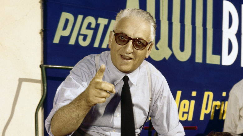 Enzo Ferrari smiling and pointing