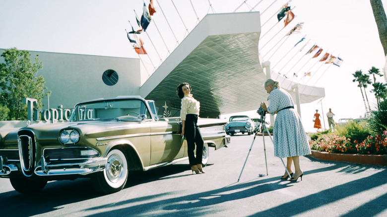 Actress Kitty Dolan poses in front of 1958 Ford Edsel and the Tropicana