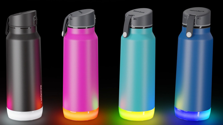 Four HidrateSpark Pro water bottles in different colors