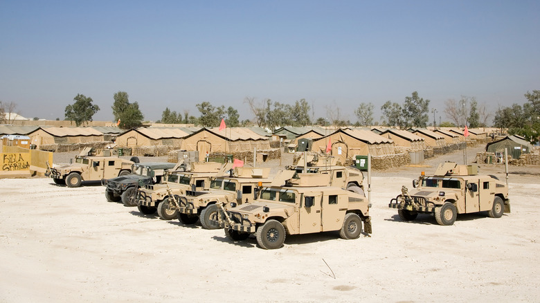 Convoy of Humvees at a base camp