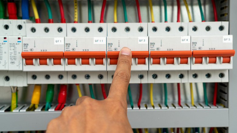 Finger pressing switches in an electrical box