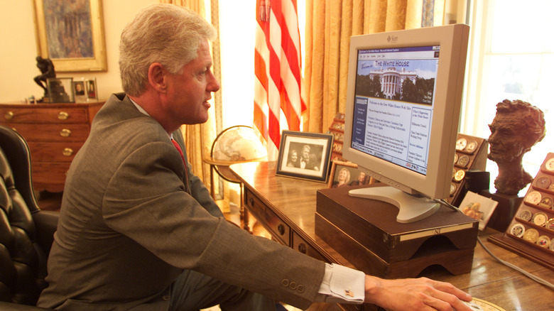 Bill Clinton looks at the new White House website on a desktop computer monitor in 1994