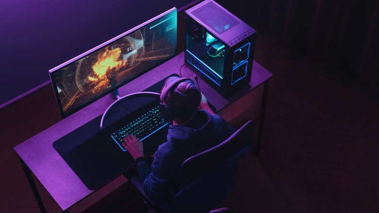 Person playing on desktop gaming pc