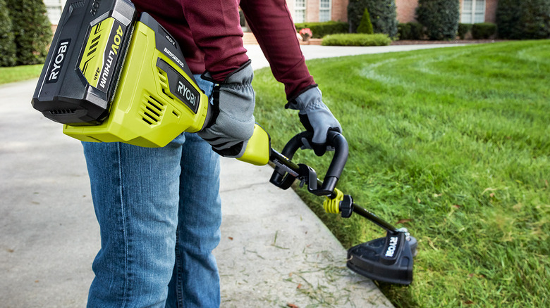 person using 40V Ryobi trimmer