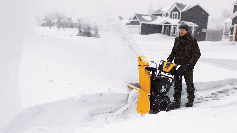 person using cub cadet snow blower