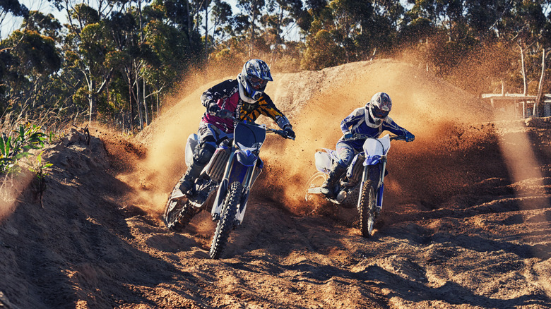 Motocross racers in a turn