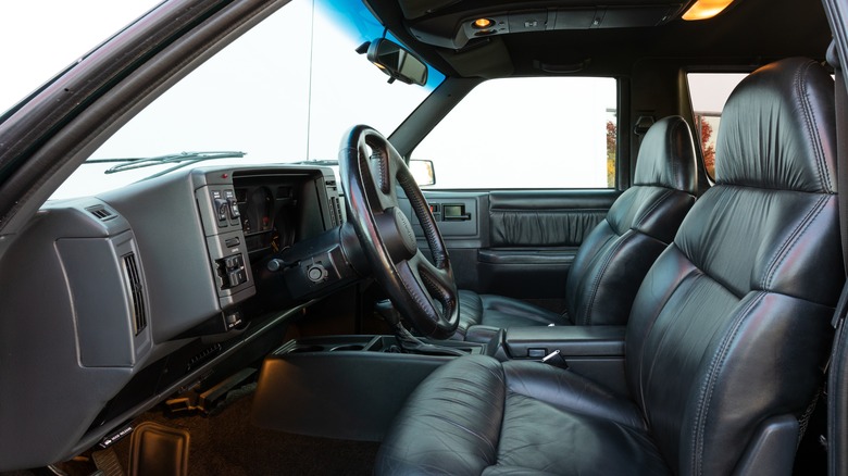 The GMC Typhoon's interior features black leather seats and a gray plastic dashboard.