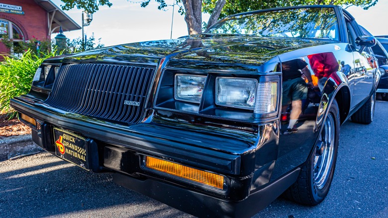 Wide angle low perspective front corner view of a 1987 Buick Grand National at a classic car show in Fernandina Beach, Florida.