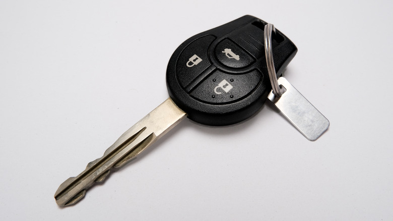 A car key kept on a white table