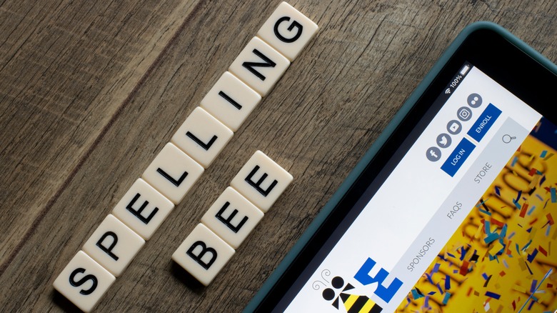 Scrabble tiles spelling out spelling bee on a table