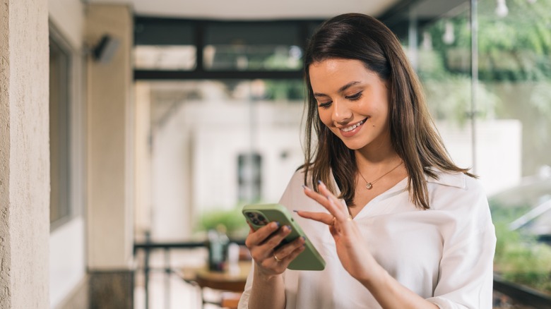 woman using green phone