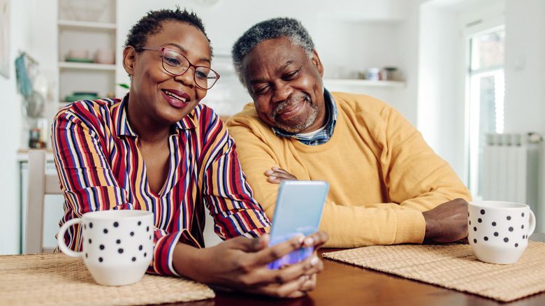 couple looking at their phone