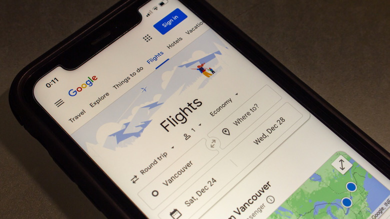 Google Flights is shown on an iPhone screen