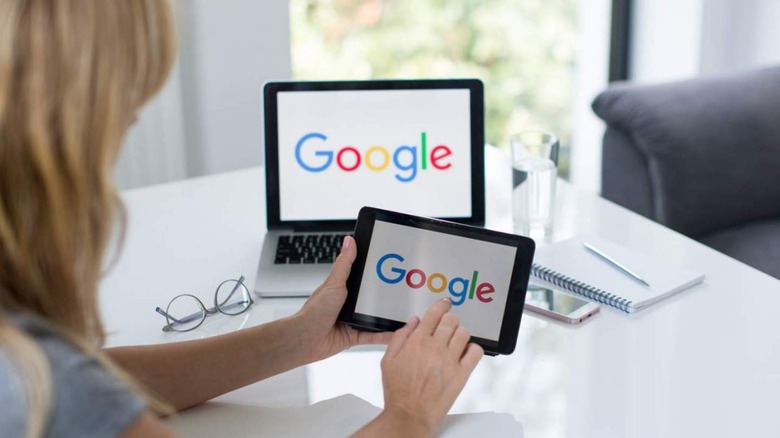 Woman with tablet and laptop 