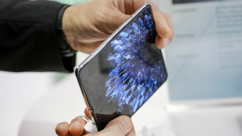 Man holding a foldable smartphone.