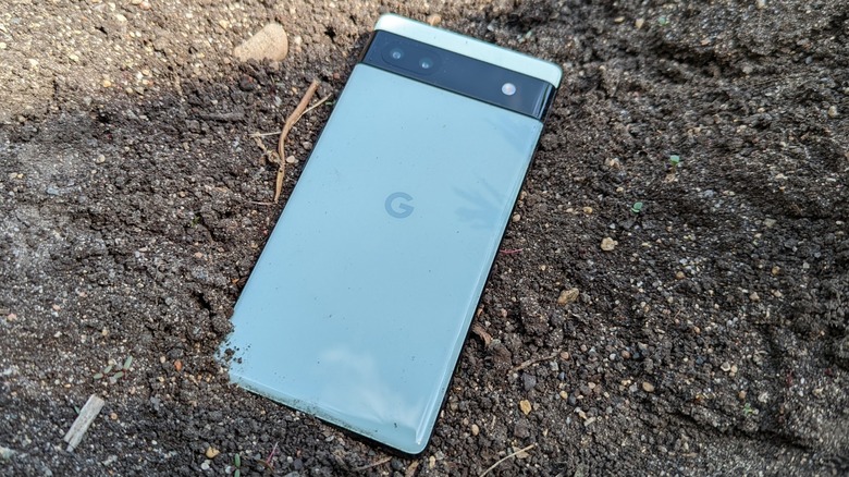 Google Pixel 6a in black dirt