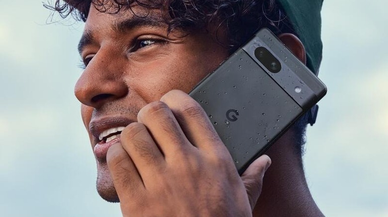 Person holding the Google Pixel 7a.