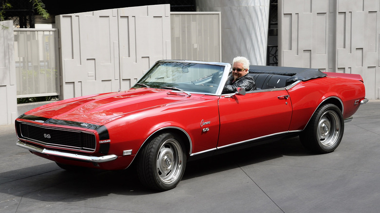 Guy Fieri in red Camaro