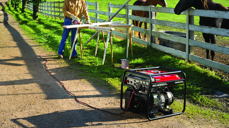 Honda generator powering a saw