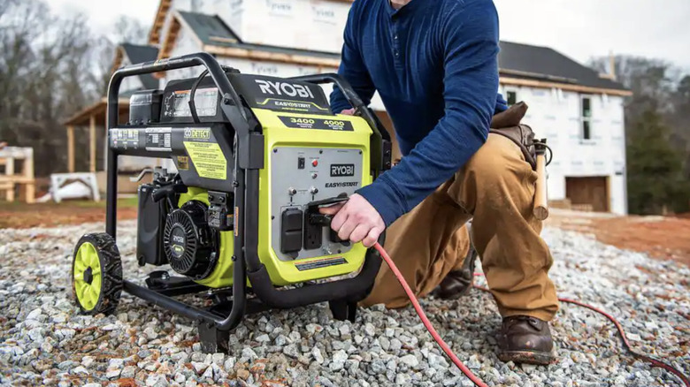 plugging extension cord into Ryobi generator