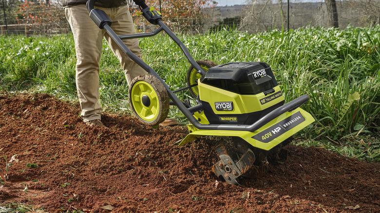 Ryobi tiller on soil