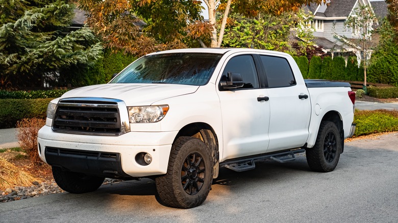 White pickup truck with bed cover