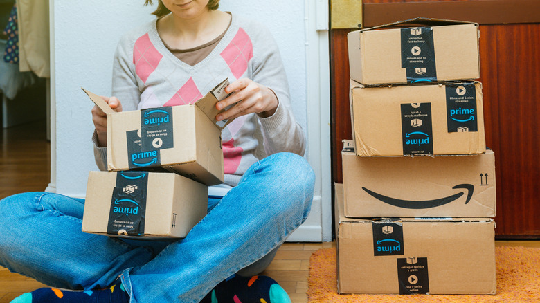 Stack of Amazon Prime packages delivered to a home