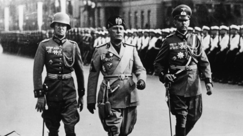 Benito Mussolini marching