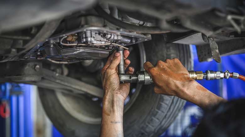 Mechanic working on an automatic transmission