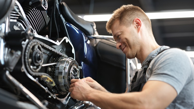 Mechanic working on motorcycle