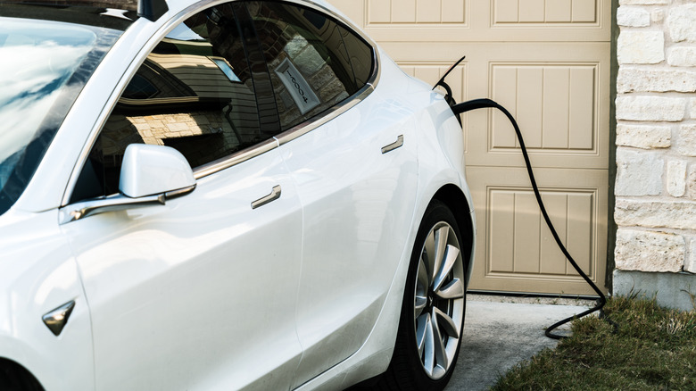 Tesla Model 3 charging driveway