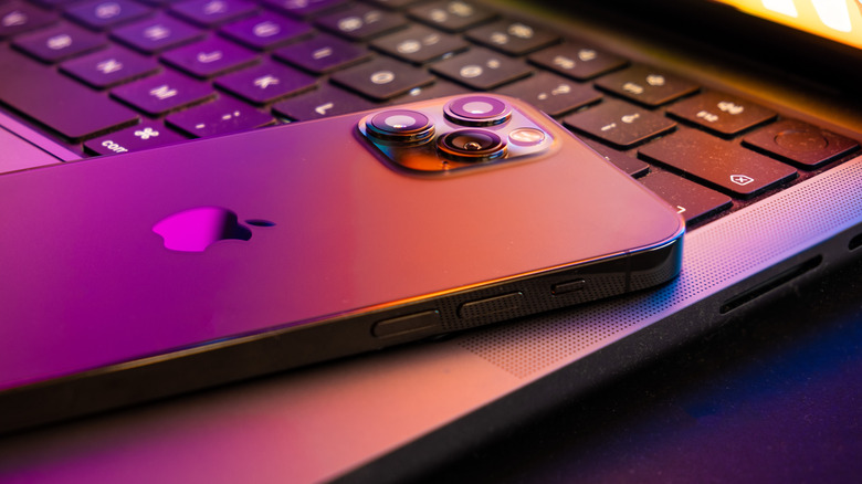 iPhone resting on laptop keyboard