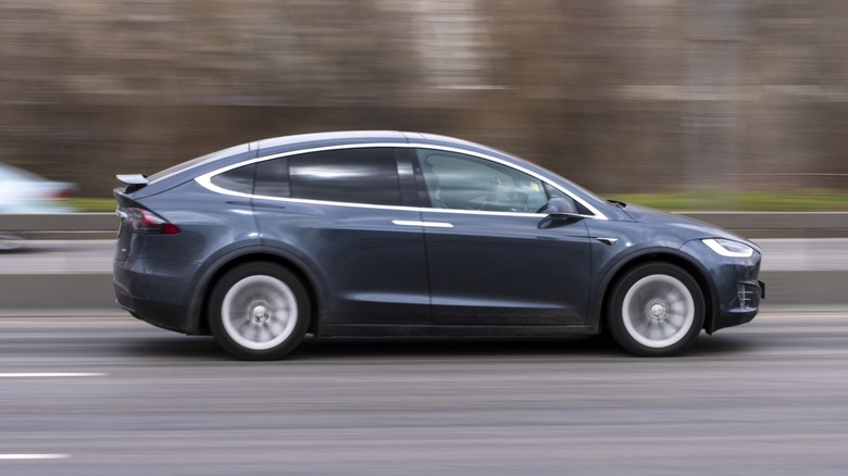 Tesla Model X driving down the road