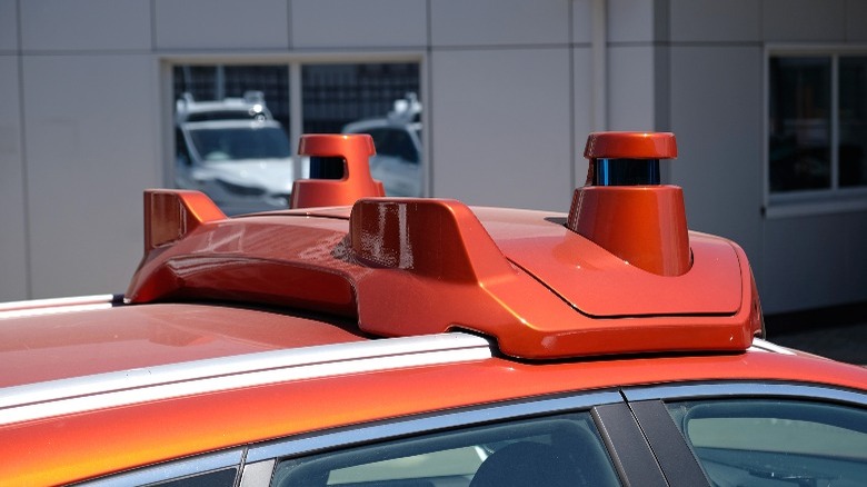 Orange car with LiDAR sensors at the top