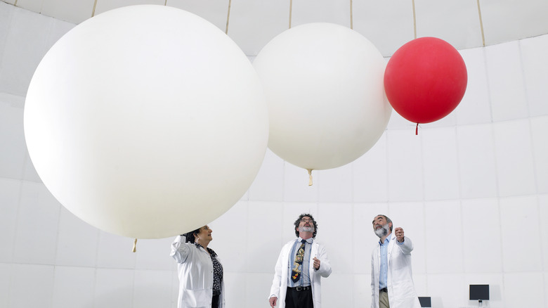 scientists with weather balloons