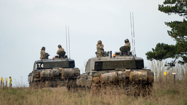 Challenger 2 tanks driving on road