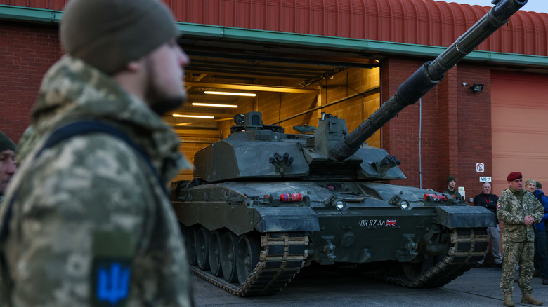 Challenger family tank emerges from building