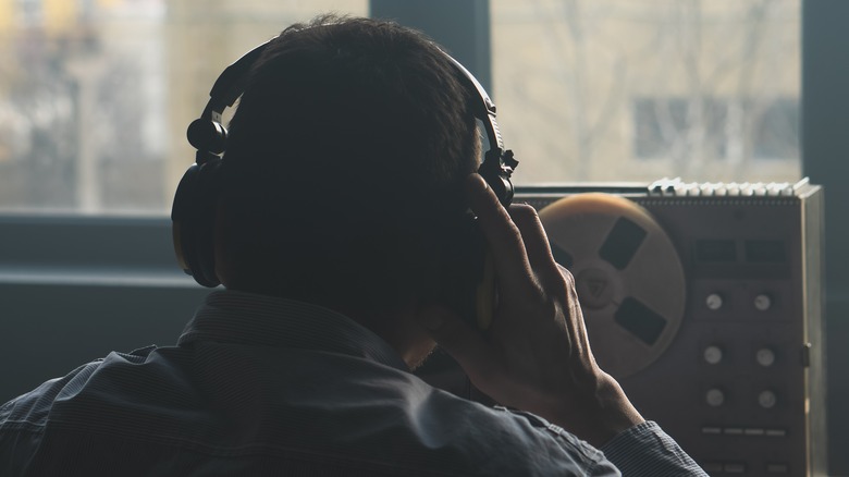 Person eavesdropping using a recorder 