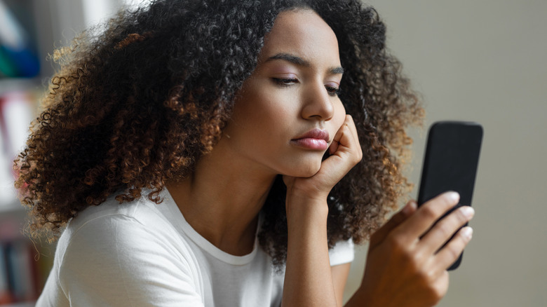 Woman looking at her smartphone