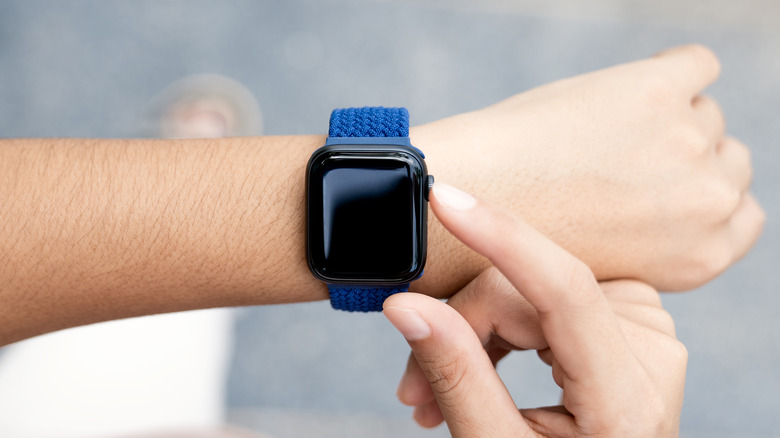 Apple Watch on a hand with blank screen