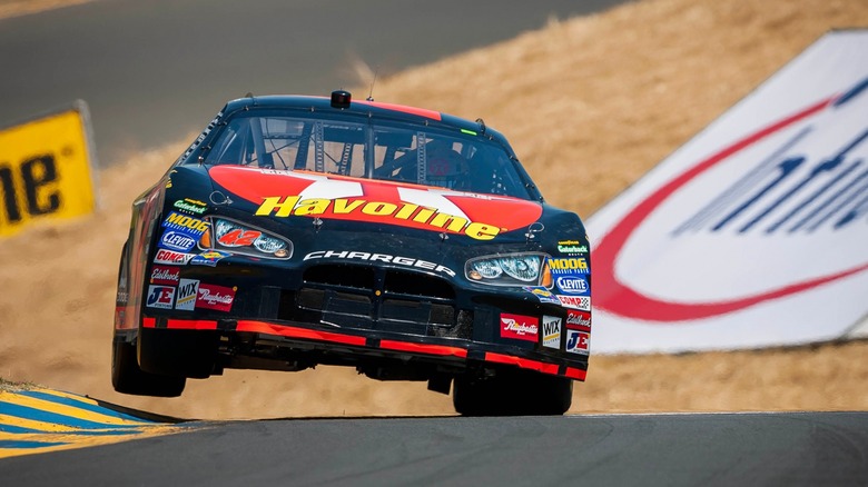 NASCAR car bouncing through a turn