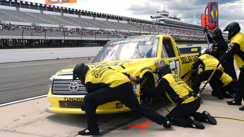 Kyle Busch in pit stop in Number 51 Tundra truck